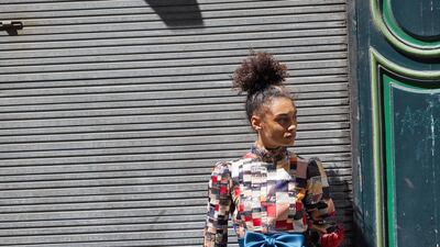 Long-sleeve top made from a patchwork of vintage materials; and petrol blue high-waisted skirt with embroidered moon artworks, both from Viktor & Rolf Haute Couture.