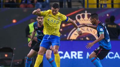 Cristiano Ronaldo controls the ball during the Saudi Pro League football match between Al Nassr and Al Wehda. AFP