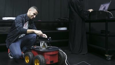 Khalifa University students, Fatema Al Hameli, 21 years old and Abdullah Al Naqeb, 20 years old, design satellites in the SPACE (Spacecraft Platform for Astronautic and Celestial Emulation) lab. Mona Al Marzooqi / The National