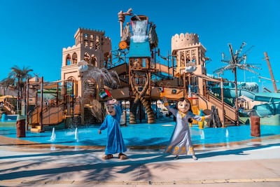 Characters dressed in traditional clothes at Yas Waterworld.