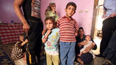 Shaimaa, now 3 years old, and Mohamed, now 8, lost their mother in the 2008 rockslide and now live with their grandmother's family of eight in a two-room flat in a housing project.