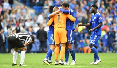 Cardiff City players congratulate goalkeeper Neil Etheridge after saving a penalty from Newcastle United's Kenedy last weekend. AP Photo