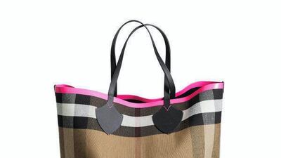 Burberry's checked motif is updated with a fluouro-pink top, and thanks to 200 years of company know-how, the colour is unlikely to fade anytime soon