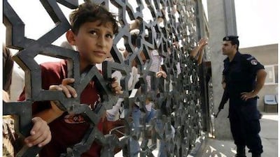 Palestinians wait in vain to cross into Egypt at the Rafah border crossing in the southern Gaza Strip yesterday. Ibraheem Abu Mustafa / Reuters
