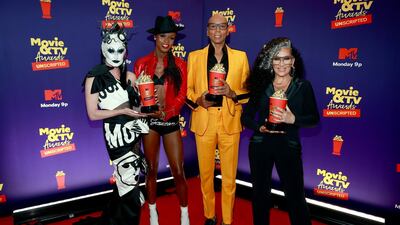 Gottmik, Symone, RuPaul, and Michelle Visage, winners of Best Reality Cast for 'RuPaul's Drag Race', pose backstage during the 2021 MTV Movie & TV Awards: Unscripted in Los Angeles, California on May 17, 2021. Getty Images