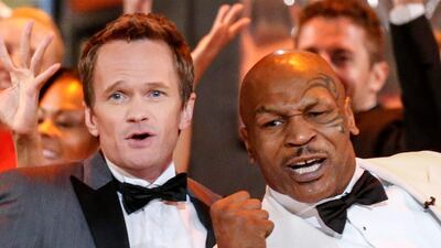 Host Neil Patrick Harris, left, and retired boxer Mike Tyson perform during the opening number of the Tony Awards. Lucas Jackson / Reuters
