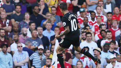 Liverpool’s Brazilian midfielder Philippe Coutinho celebrates scoring their first goal to equalise 1-1 during the Premier League football match between Arsenal and Liverpool at the Emirates Stadium in London on August 14, 2016. Lee Mills / AFP