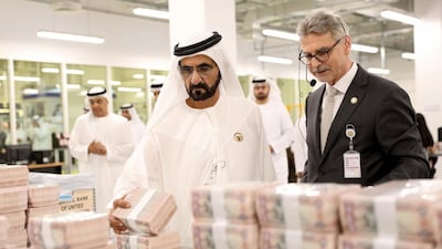 Sheikh Mohammed bin Rashid, Vice President and Ruler of Dubai, inspects currencies at the UAE’s first banknote printing plant at Khalifa Industrial Zone Abu Dhabi on Saturday. Wam