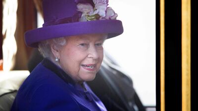Britain's Queen Elizabeth II and King Willem-Alexander of the Netherlands (unseen) ride together in the State Coach Britannia from a Ceremonial Welcome on Horse Guards Parade to Buckingham Palace in London at the start of the Dutch King and Queen's two-day state visit. Victoria Jones / AFP