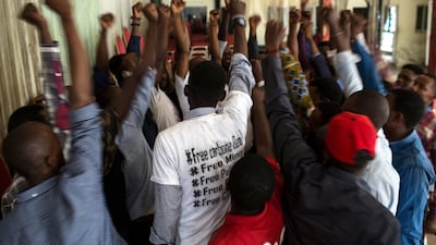 The Kinshasa cell of Filimbi, a pro-democracy group whose name means "whistle" in Swahili, end a secret meeting in Kinshasa with a cheer. Holly Pickett for The National