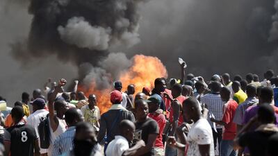 Demonstrators in Ouagadougou, Burkina Faso, set fire to the country’s parliament yesterday . Issouf Sanogo / AFP