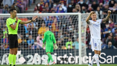 Real Madrid midfielder Toni Kroos celebrates victory a 2-1 victory at the end of the clasico at Camp Nou on October 24, 2021. AFP