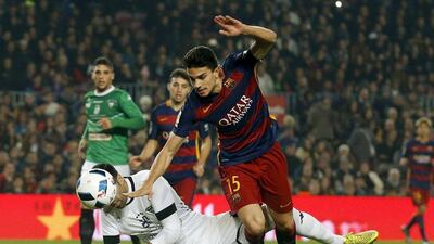 Marc Bartra of Barcelona fights for the ball against Villanovense keeper Jose Fuentes during their contest on Wednesday night in the Copa del Rey. Albert Gea / Reuters