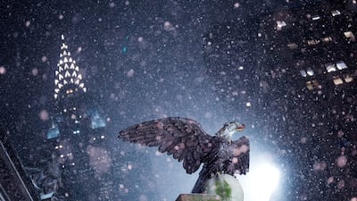 The Chrysler Building rises behind Grand Central Station as snow falls during a winter storm in New York City. Reuters