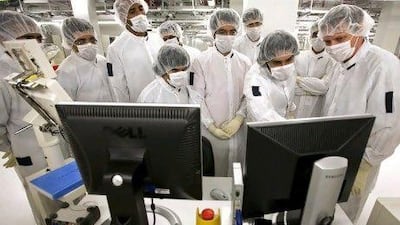 Engineering students from the UAE learn how silicon wafers are tested at Globalfoundries's plant in Dresden, Germany. Jeff Topping / The National