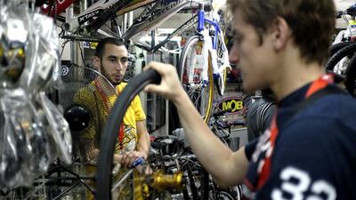 Muhammad Attia and Muhammad El Maud of the American University of Sharjah team scour the streets of Manila to find replacement parts for their car. Jes Aznar for The National