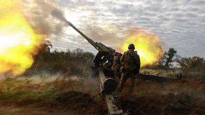 Ukrainian servicemen shoot from a captured Russian howitzer on a front line near Kupyansk city in 2022. EPA