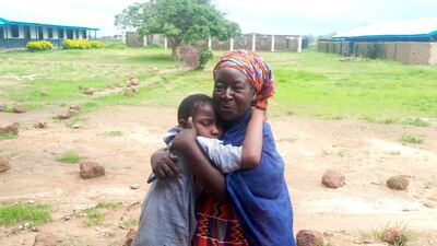 A mother is reunited with a Bethel Baptist High School pupil released by gunmen in Damishi, Nigeria, on Sunday. AP