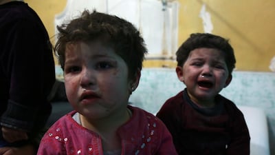 Children cry in a hospital in the rebel-held town of Douma, in the besieged Eastern Ghouta region on the outskirts of the capital Damascus, following reported regime bombardment on the area on February 24, 2018. Hamza Al-Ajweh / AFP