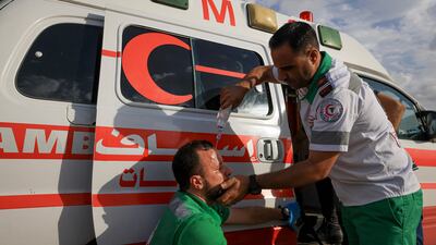 A Palestinian Red Crescent medic (R) in Gaza, on September 13, 2023. AFP