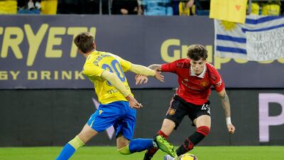Cadiz's Carlos Garcia fights for the ball with Manchester United's Alejandro Garnacho. Reuters