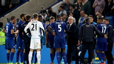 Leicester City manager Claudio Ranieri, centre right, speaks to his players before extra time. Nick Potts / PA / AP