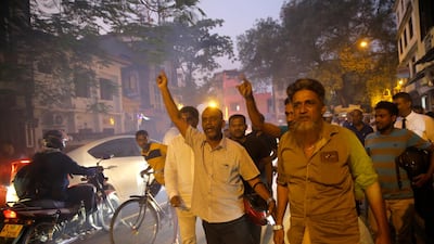 In this Nov. 13, 2018 photo, supporters of Sri Lanka's ousted Prime Minister Ranil Wickremesinghe celebrate after the Supreme Court suspended dissolution of parliament by President Maithripala Sirisena. AP