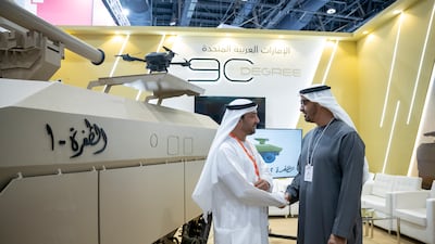 Sheikh Mohamed talks to one of the exhibitors at the event