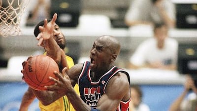 Michael Jordan, centre, pictured during a game against Brazil at the Barcelona Summer Olympics on July 31, 1992, won his first gold medal in 1984 but also suffered from a dental problem that threatened his participation. Stephan Sevoia / AP Photo