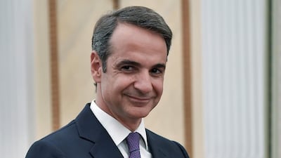 Leader of New Democracy conservative party and winner of Greek general election Kyriakos Mitsotakis smiles during his swearing-in ceremony as a prime minister of Greece at the presidential palace in Athens. AFP