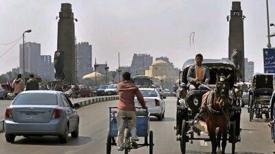 A young man rides his carriage horse in central Cairo on March 12, 2011, as life resumes to normal following the over throw of long term president Hosni Mubarak on February 11. AFP PHOTO / ARIS MESSINIS