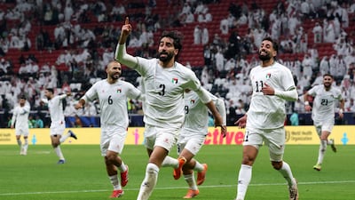 Palestine's Mohammed Saleh celebrates his team's first goal against Qatar in the Fifa Arab Cup at the Al Bayt Stadium. Reuters