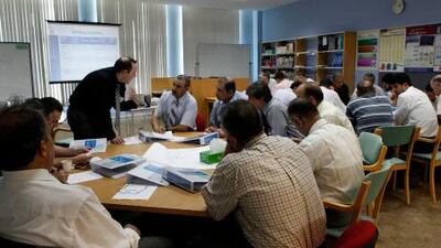 Public school teachers attend a workshop at Sharjah Men's College. According to the Ministry of Education, many of the Arab expatriates teaching Emiratis in public schools are not properly trained, and 1,460 of them do not hold university degrees.