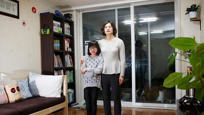 Kang Hyun-jeong, 43, and her daughter Yoo Ha-min, 11, in the living room of their apartment in Seoul. Kang Hyun-jeong works in accounts. She says that she started working in her senior year of high school, but she began a business degree in 1999 at the Korea National Open University because she wanted to focus on her studies. She juggled work and classes and graduated eight years later in 2007. She hopes to get a masters degree when her children grow up. Kang Hyun-jeong says her children are talented in the arts but she knows that the reality is that it is difficult to make money through art. Her daughter Yoo Ha-min wants to be a designer or a painter. Kim Hong-Ji / Reuters
