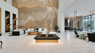 Enter via a striking double-height central hub.