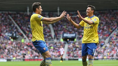 Arsenal's midfielder Mesut Ozil hit the ground running with two assists. Ian Macnicol / AFP