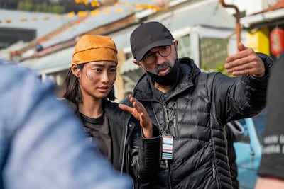 Shioli Kutsuna and Alik Sakharov on the set of Invasion. Photo: Apple TV+