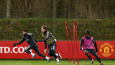Jesse Lingard, James Garner and Angel Gomes of Manchester United during training. Getty Images