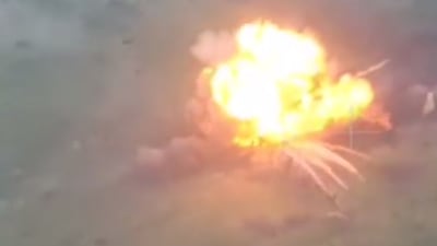 Drone footage shows the moment a Russian T-55 tank - reportedly packed with tonnes of high explosives - is detonated by remote-control near Ukrainian positions. Source: Telegram/@romanov_92