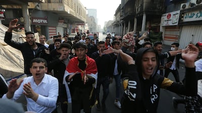 Iraqi protesters chant slogans during a demonstration in Baghdad's al-Rasheed street near al-Ahrar bridge. AFP