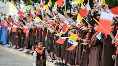 Schoolchildren welcome the Pope to Bahrain. Khushnum Bhandari / The National
