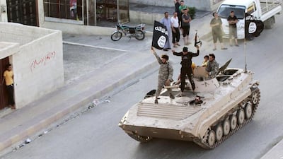 Militant Islamist fighters take part in a military parade along the streets of northern Raqqa province. Stringer / Reuters
