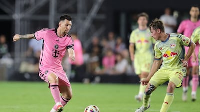 Lionel Messi on the ball as Red Bulls midfielder Daniel Edelman attempts to close him down. AFP