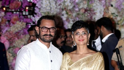 Aamir Khan poses for a picture with his wife Kiran Rao Khan as they attend the engagement party of India's richest man and Reliance Industries Limited Chairman, Mukesh Ambani’s eldest son Akash Ambani and fiancee Shloka Mehta, in Mumbai on June 30, 2018. AFP