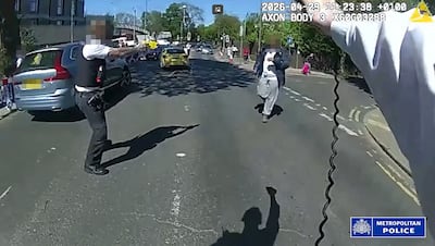 Police bodycam photos shows the moment a man suspected of stabbing two men in north London was confronted. AFP