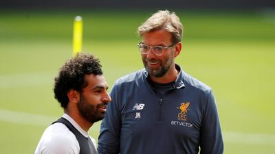 Liverpool manager Jurrgen Klopp, right, with Mohamed Salah. Reuters