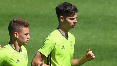 Julian Weigl of Germany runs with his team mate Joshua Kimmich (L) during a Germany training session ahead of their Uefa Euro 2016 semi-final against France at Ermitage Evian on July 06, 2016 in Evian-les-Bains, France. Alexander Hassenstein / Getty Images