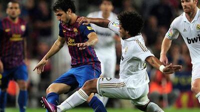 Cesc Fabregas, with the ball, and the rest of his Barcelona teammates do not want to hear about how Marcelo and his Real Madrid teammates may be the better team in La Llga.