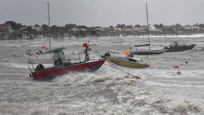 Boats are hit by strong waves during Miguel storm at Angoulins's harbour. AFP