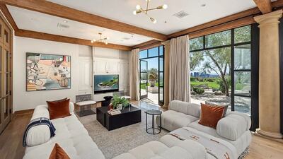 The living room looks out over the lush gardens